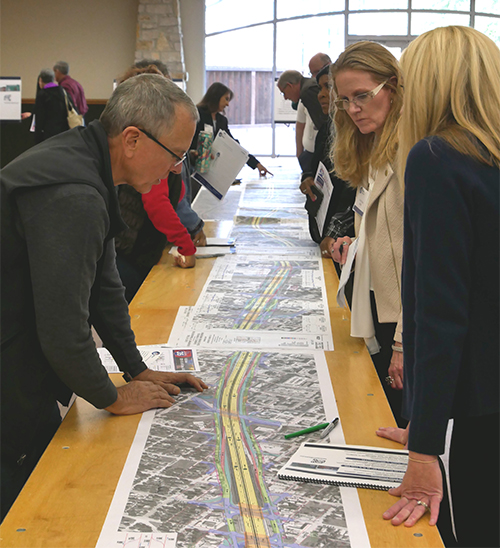 Waco residents and business owners viewing schematics of the 4B project