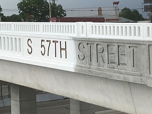 S 57TH STREET bridge railing sign